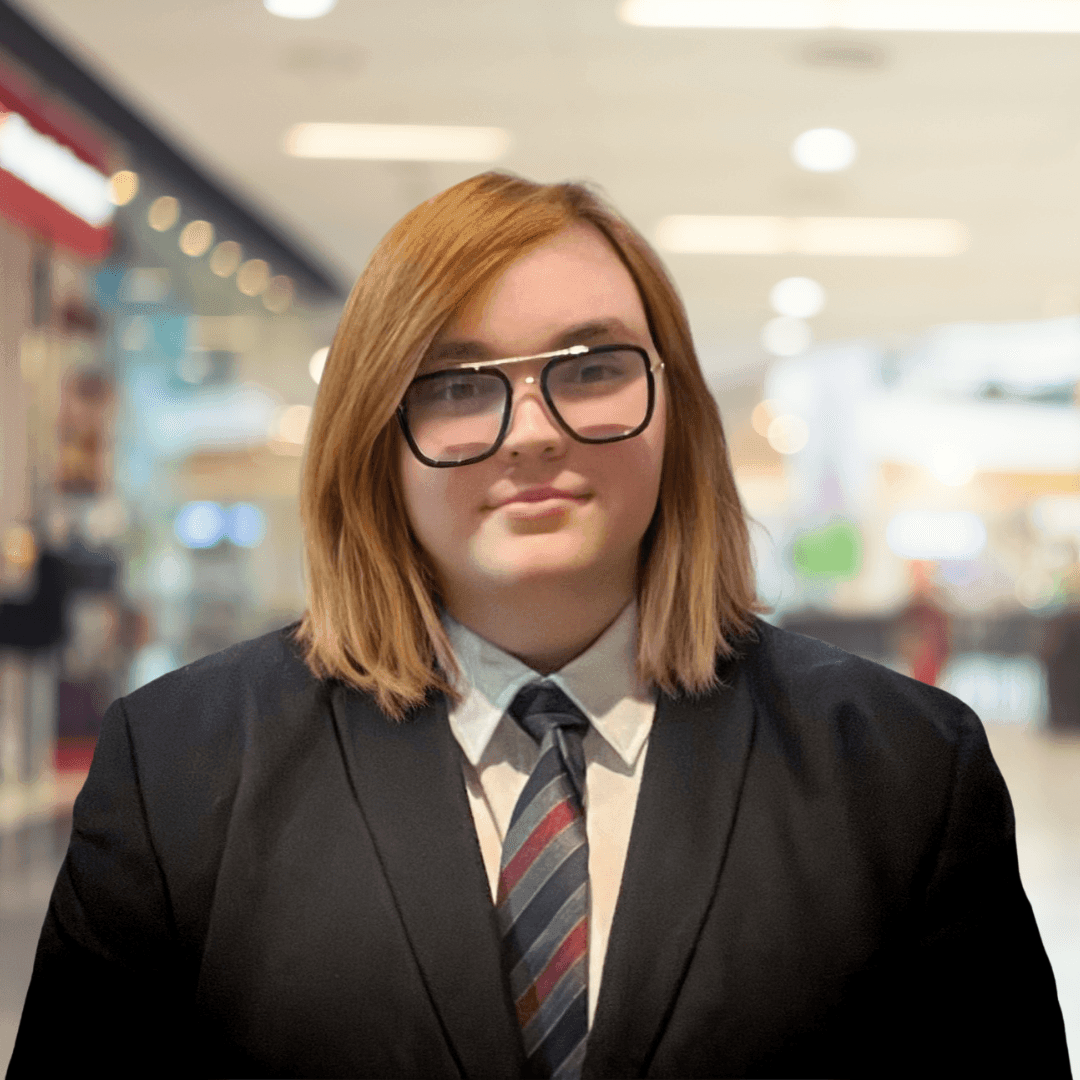 Security Consultant in a mall wearing a suit and tie